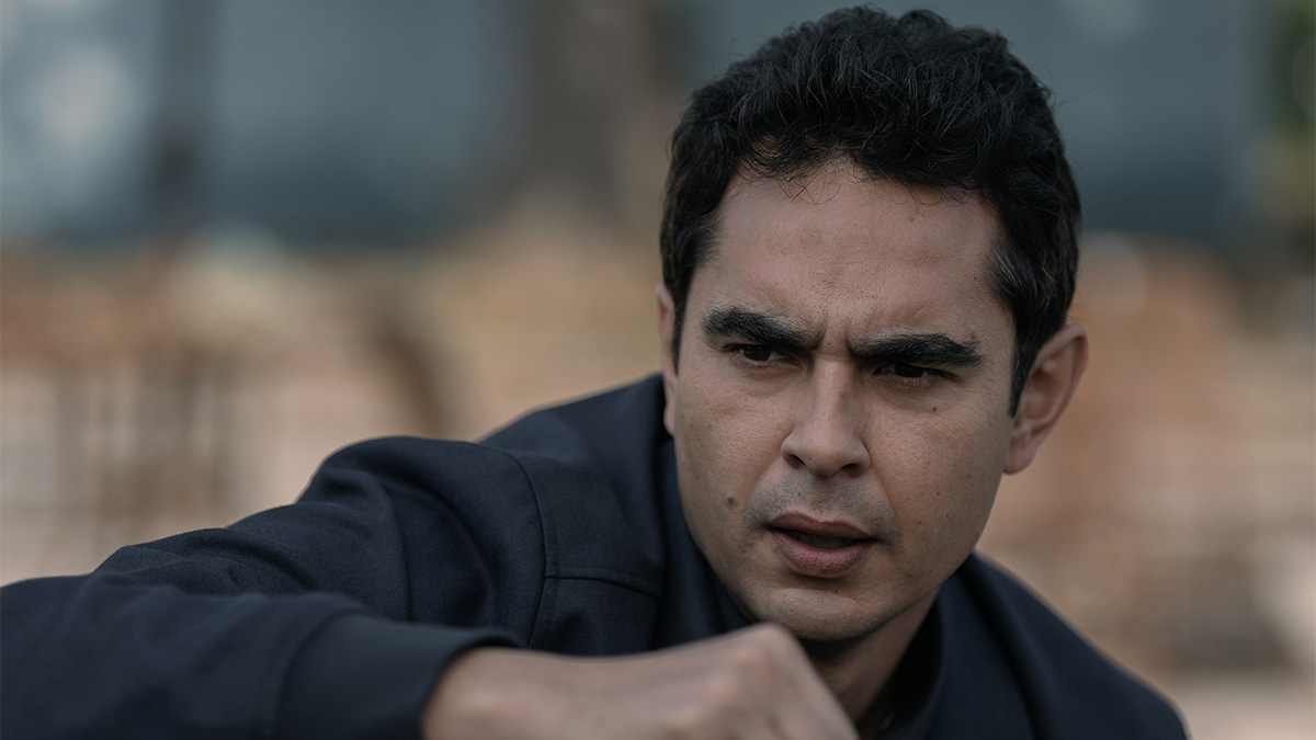 Max Minghella as Nick looking worried in The Handmaid's Tale season 6