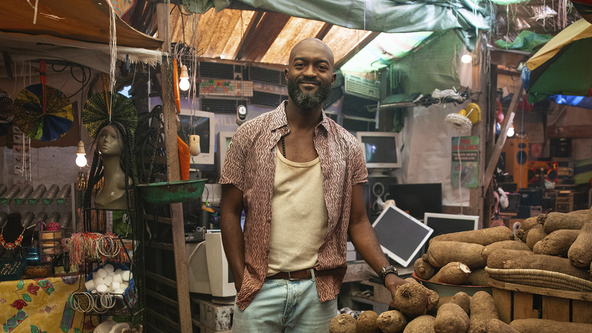 Inua Ellams in a Nigerian-styled street market for Doctor Who series 15